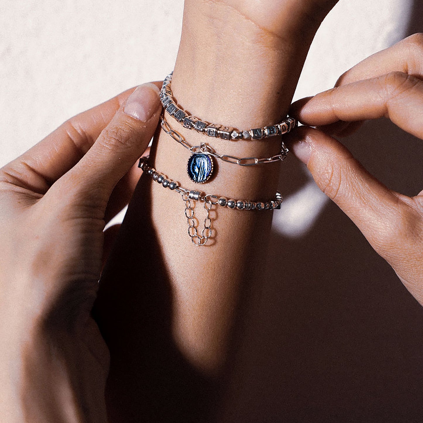 Higher Calling Bracelets hope and sympathy gift bracelets in sterling silver, shown stacked on arm