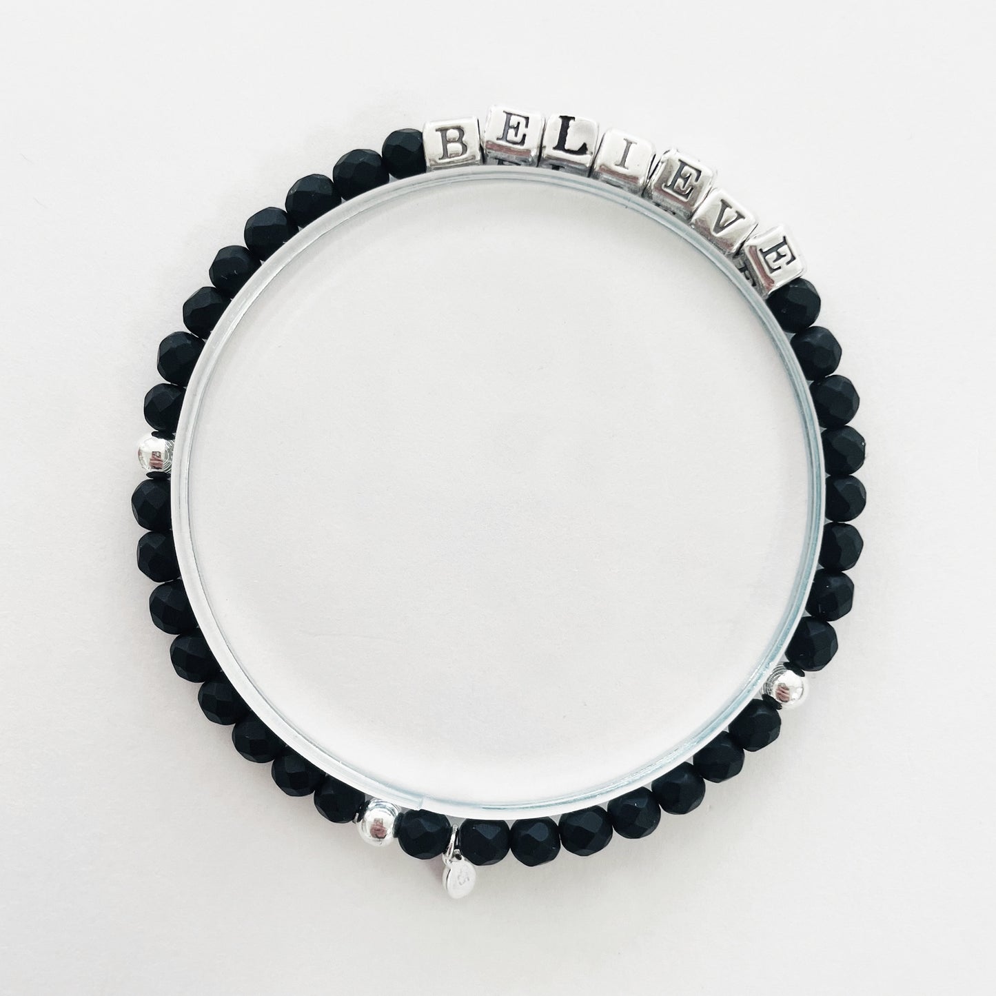 High quality sterling silver and onyx beaded elastic bracelet that spells out the word BELIEVE