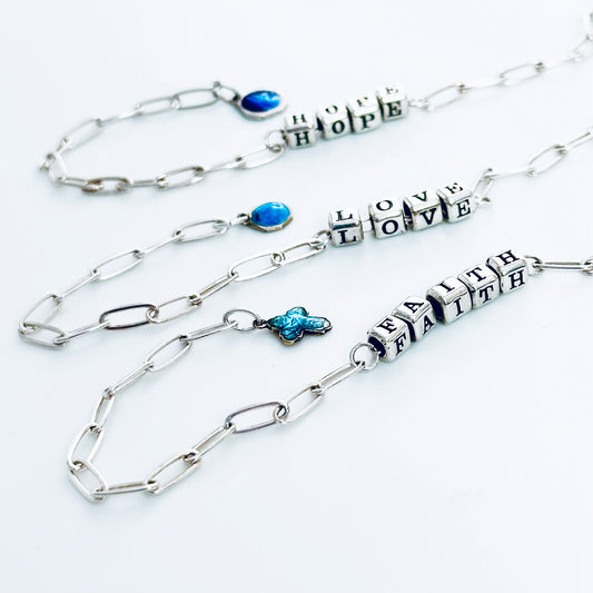 Delicate sterling silver Faith Hope Love message gift bracelets with vintage blue charms of a cross, Sacred Heart of Jesus, and Our Lady