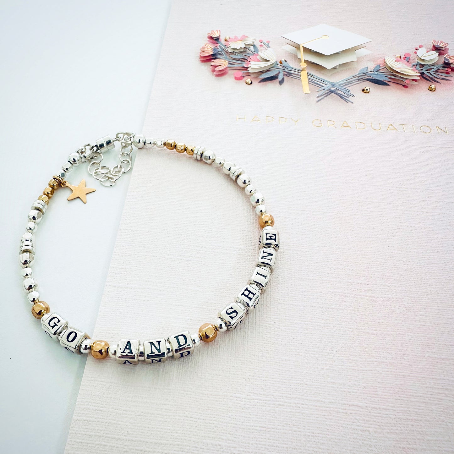 Go and Shine Good Luck, Graduation, New Job Bracelet in sterling silver and gold, featuring a magnetic closure and gold star