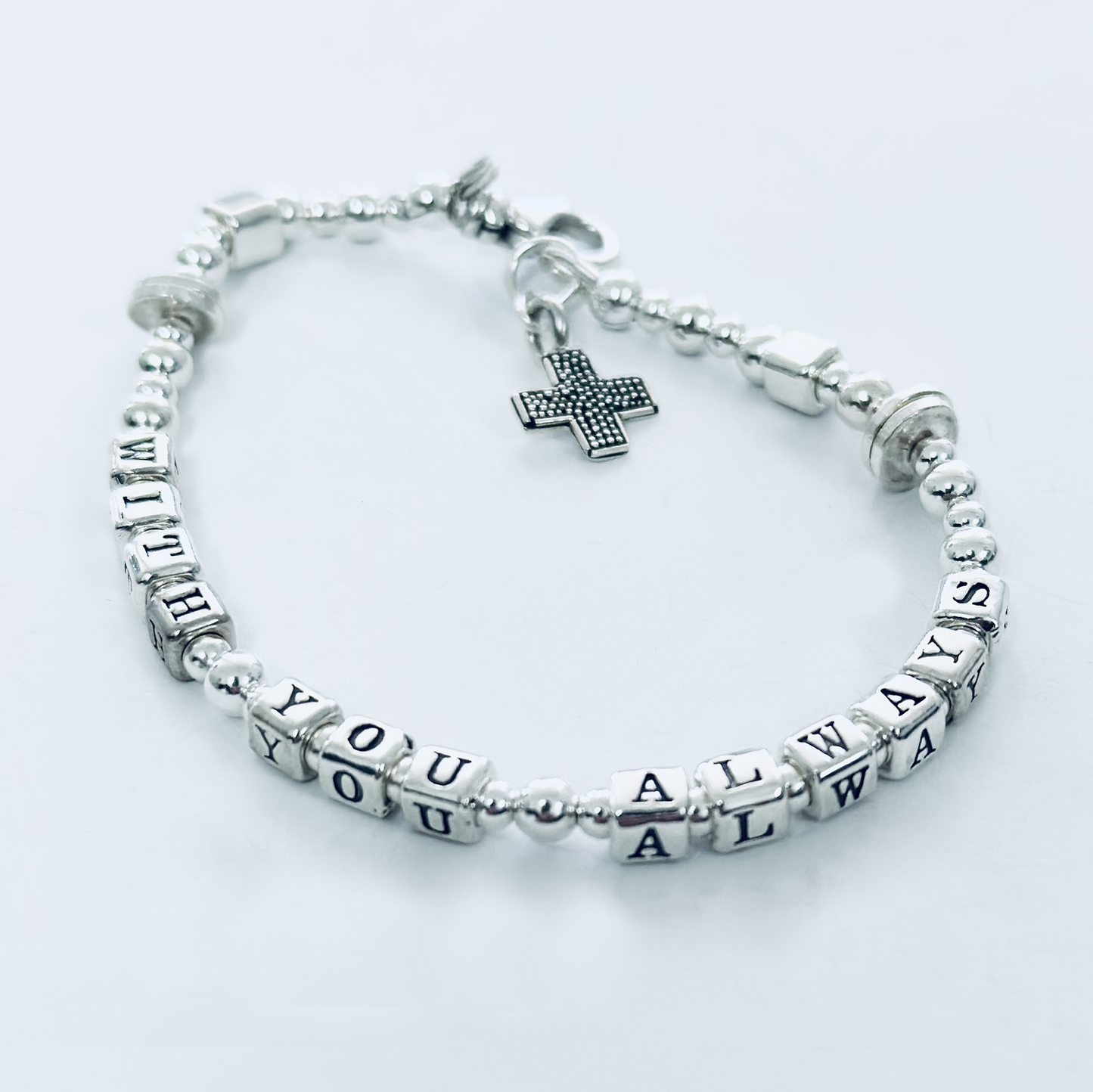 Sterling silver message bracelet with cross charm spells out bible verse Matthew 28:20, "With You Always"