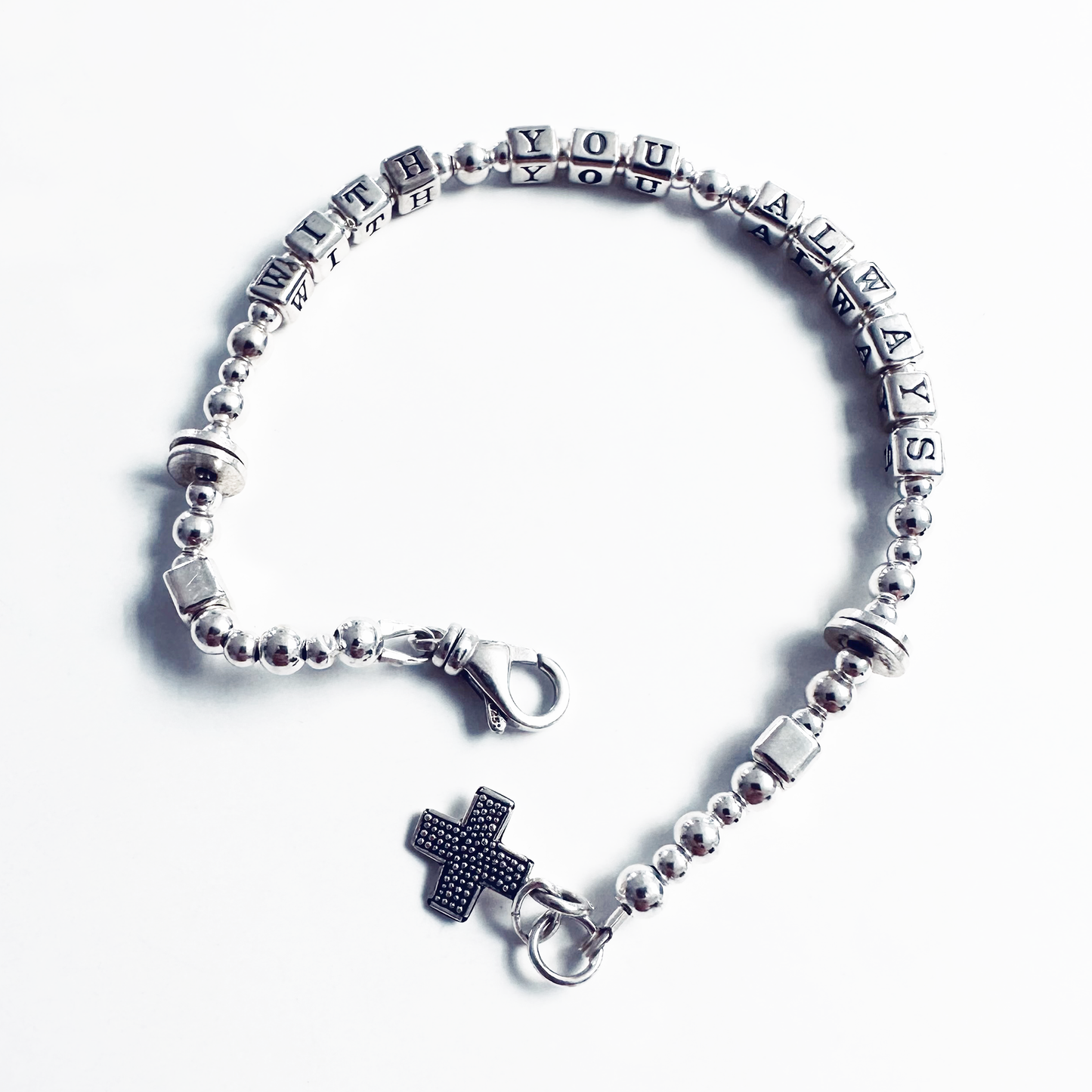Sterling silver message bracelet with cross charm spells out bible verse Matthew 28:20, "With You Always"