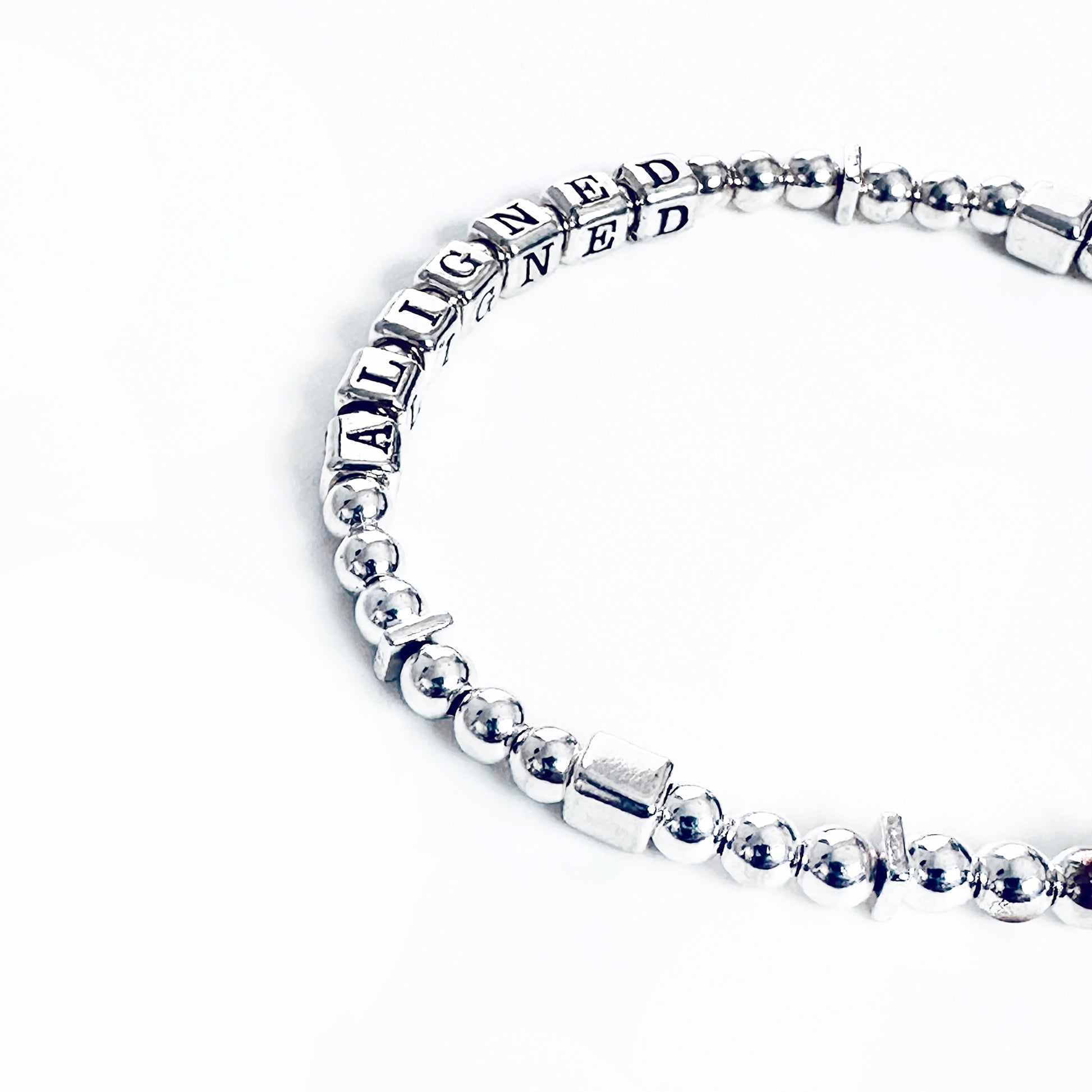 Sterling Silver engraved  bracelet that says Aligned 