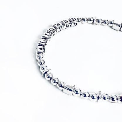Sterling Silver engraved  bracelet that says Aligned 