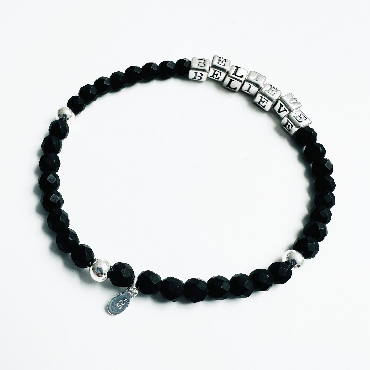 High quality sterling silver and onyx beaded elastic bracelet that spells out the word BELIEVE