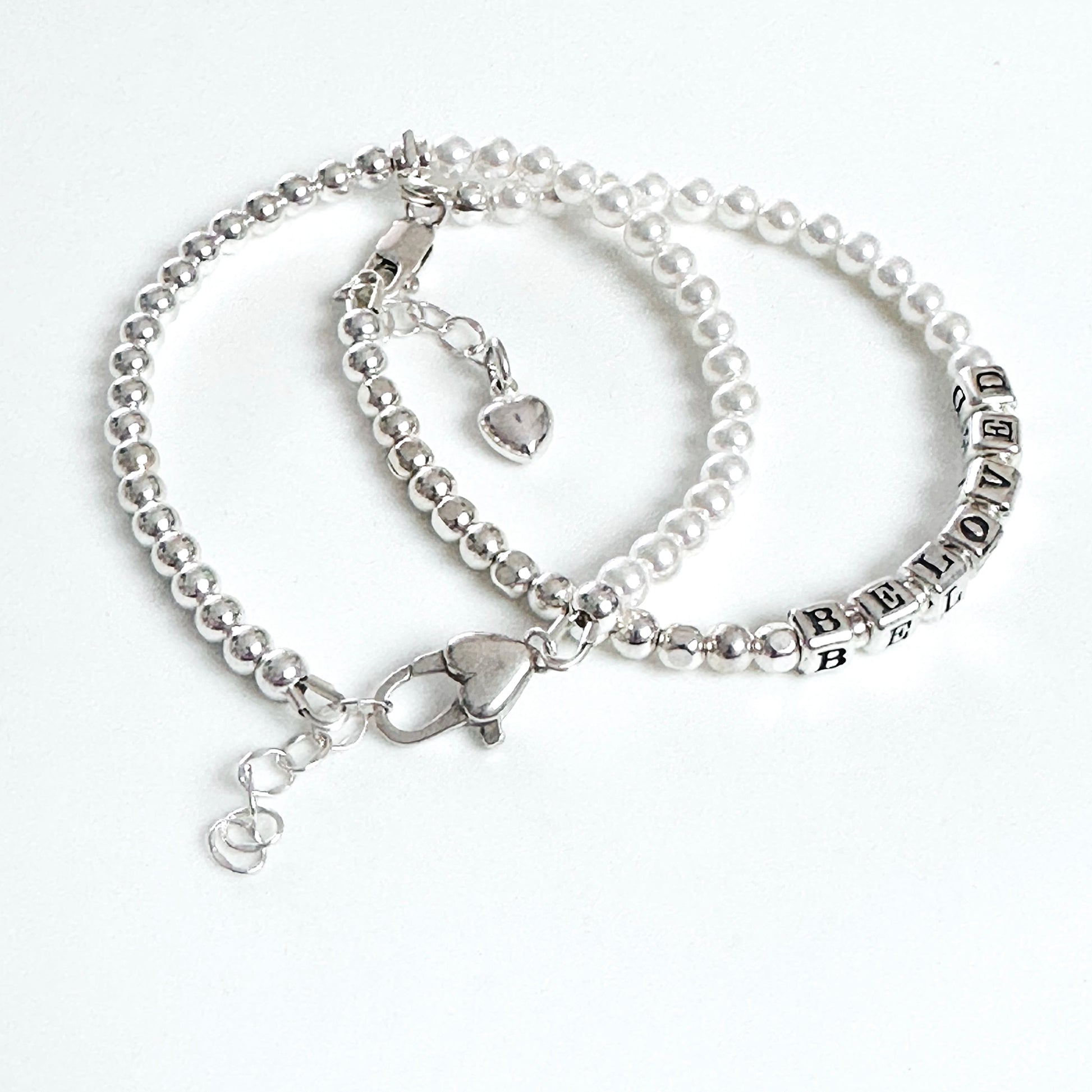 Beloved Mother's Day Bracelet in sterling silver and pearls and heart charm, shown with mixed sterling and pearl stacking bracelet