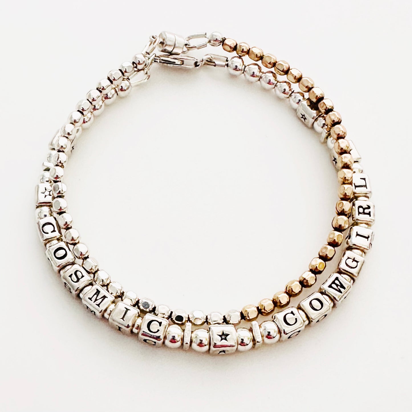 Cosmic Cowgirl Sterling silver engraved message bracelet shown with gold and silver mixed metal beaded bracelet