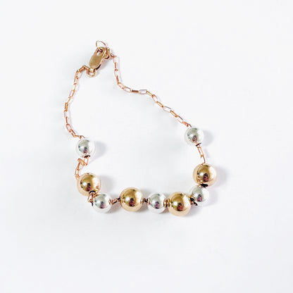 Delicate 14k gold-fill bracelet with sterling silver and gold balls