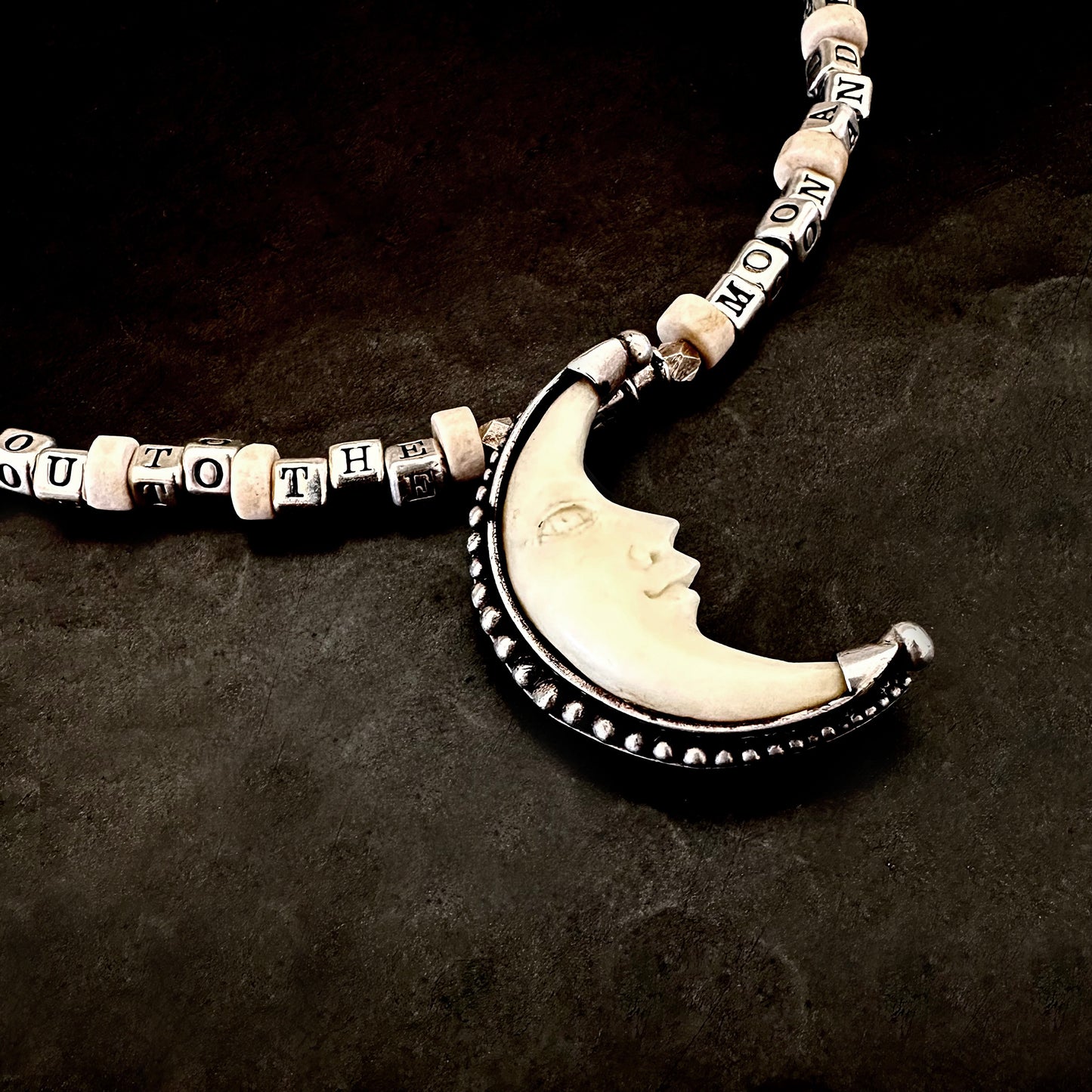 I Love You to the Moon and Back sterling silver necklace with vintage crescent moon in bone and sterling. One of a kind word necklace