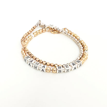 Mama Bear Sterling Silver and 14K Gold beaded bracelet with star charm shown with gold beaded stacking bracelet