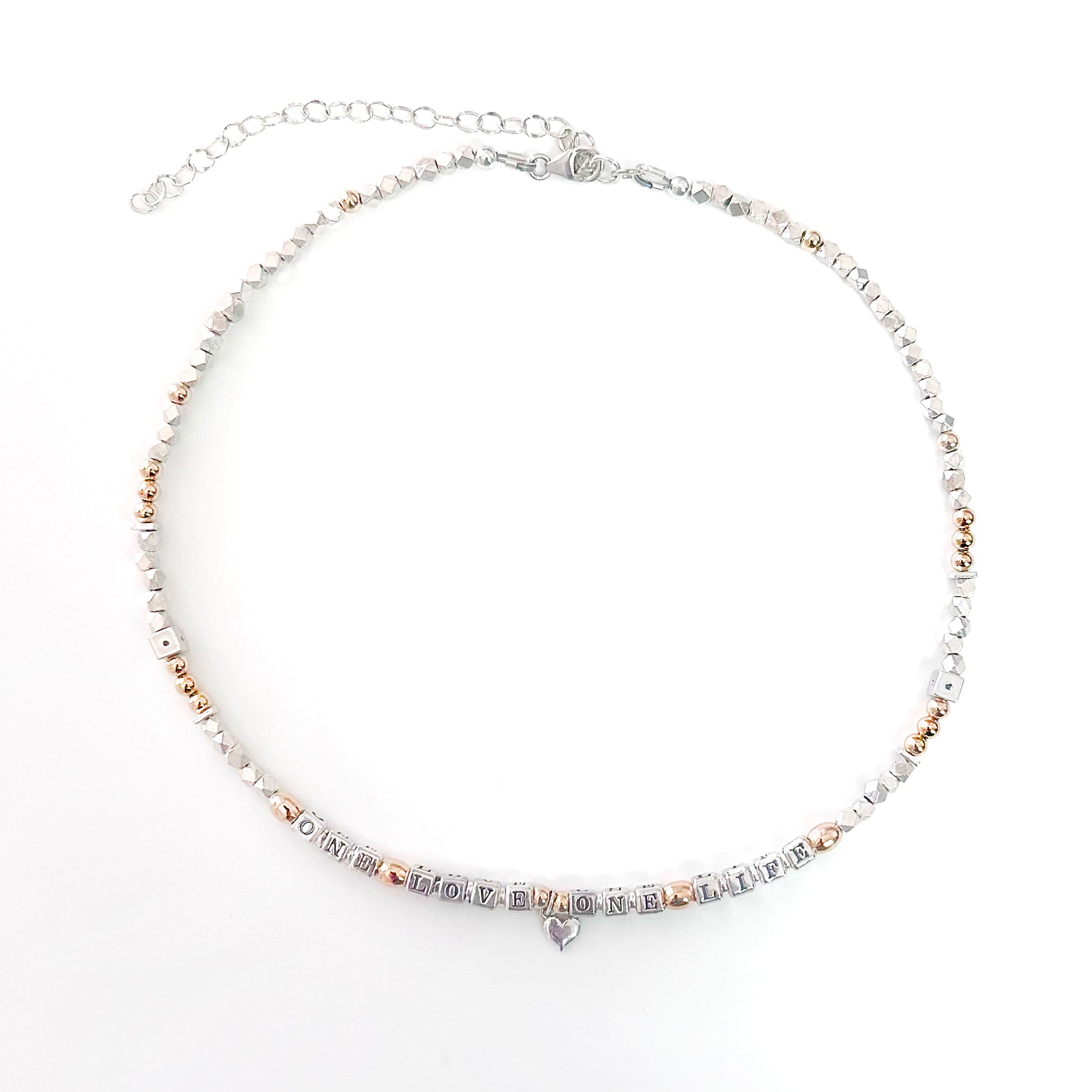 Necklace with letter beads that spell One Love One Life in sterling silver and 14k gold