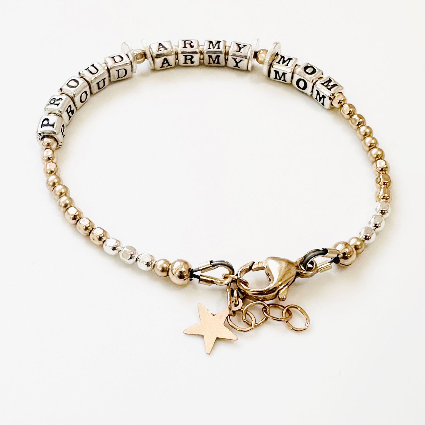 Military Mom Gift Bracelet in Sterling silver and 14k gold filled components says "Proud Army Mom."