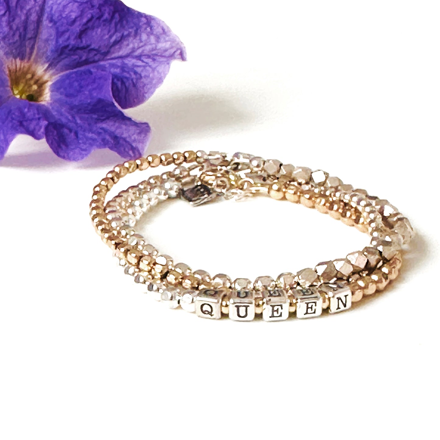 Queen Mixed Metals Sterling and 14k Gold Woman's stacking Bracelet shown with sterling silver and 14k gold beaded stacking bracelets