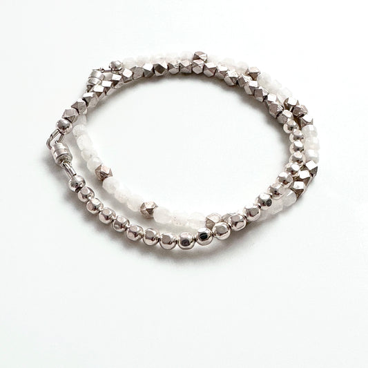 beaded sterling silver bracelet shown with white and silver beaded bracelet