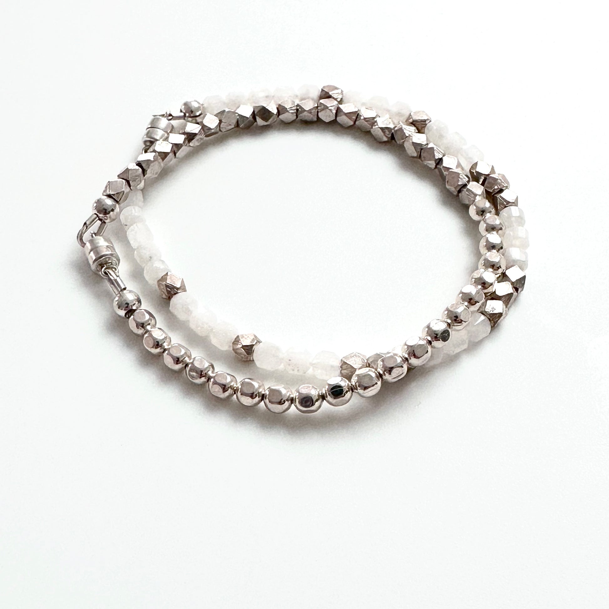 beaded sterling silver bracelet shown with white and silver beaded bracelet
