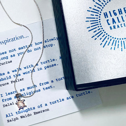 Delicate sterling silver tiny turtle necklace for patience, persistence with package showing turtle quotes, patience and persistence quotes