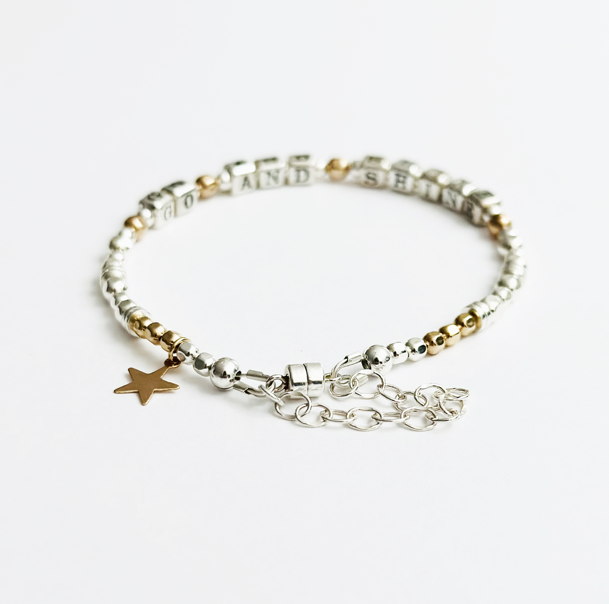 Go and Shine Good Luck, Graduation, New Job Bracelet in sterling silver and gold, featuring a magnetic closure and gold star