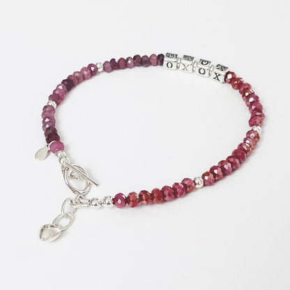 XOXO Hugs and Kisses Love and Friendship bracelet  in sterling silver and ruby gemstones