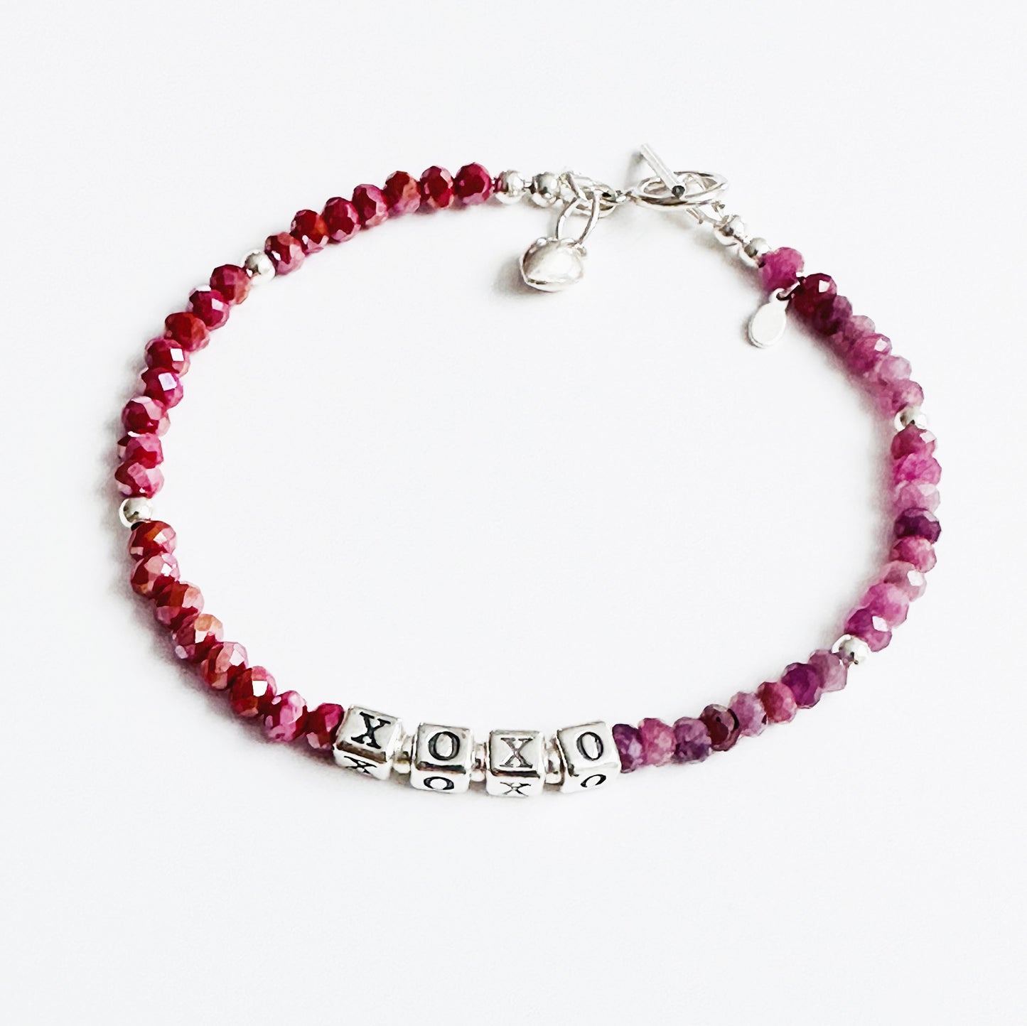 XOXO Hugs and Kisses Love and Friendship bracelet in sterling silver and ruby gemstones