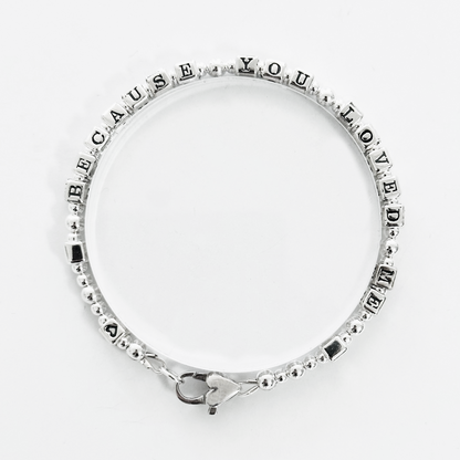 Love Bracelet in all sterling silver spells out Because You Loved Me