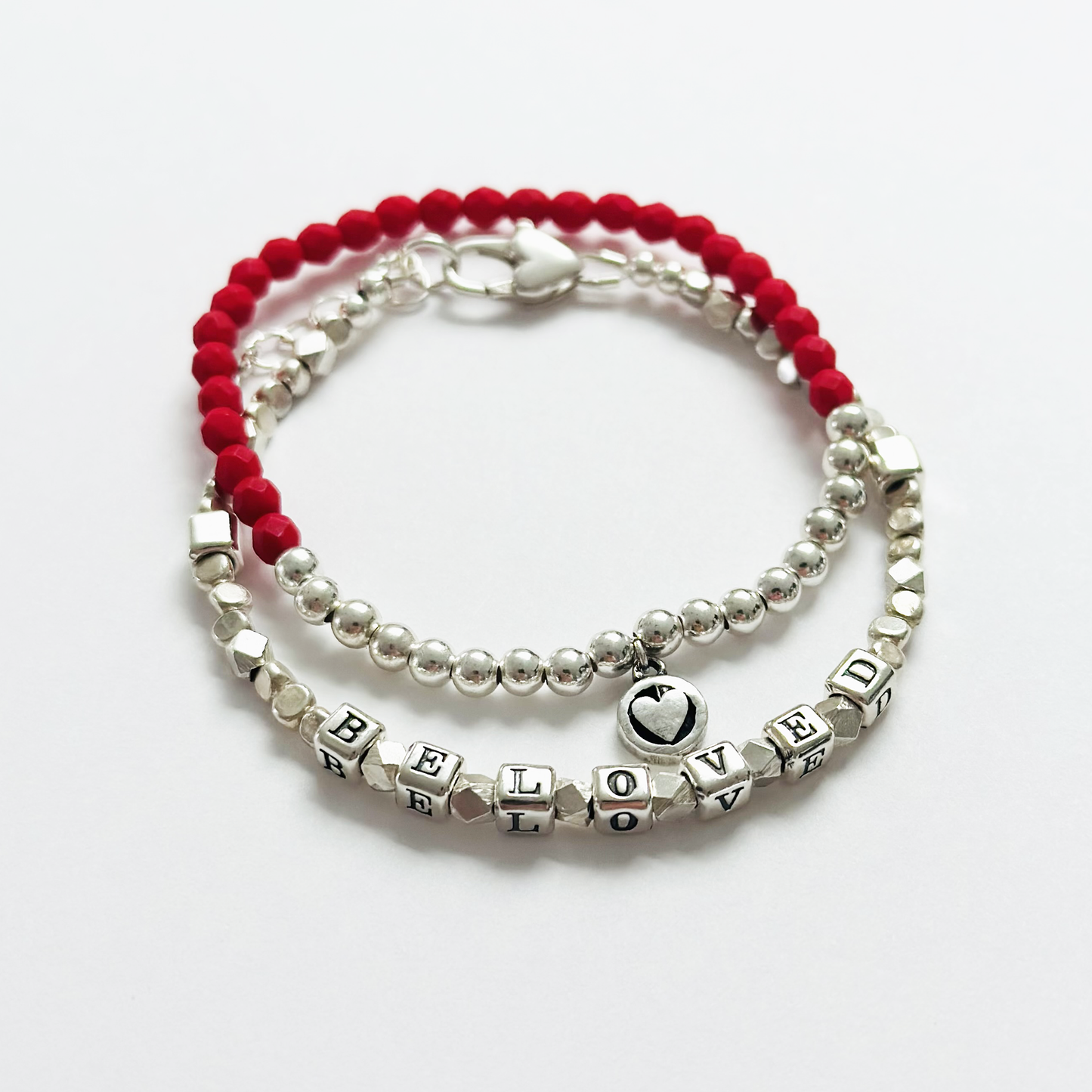 Beloved Love Engraved Message Bracelet in all sterling silver and a heart clasp, and a matching red and silver heart bracelet