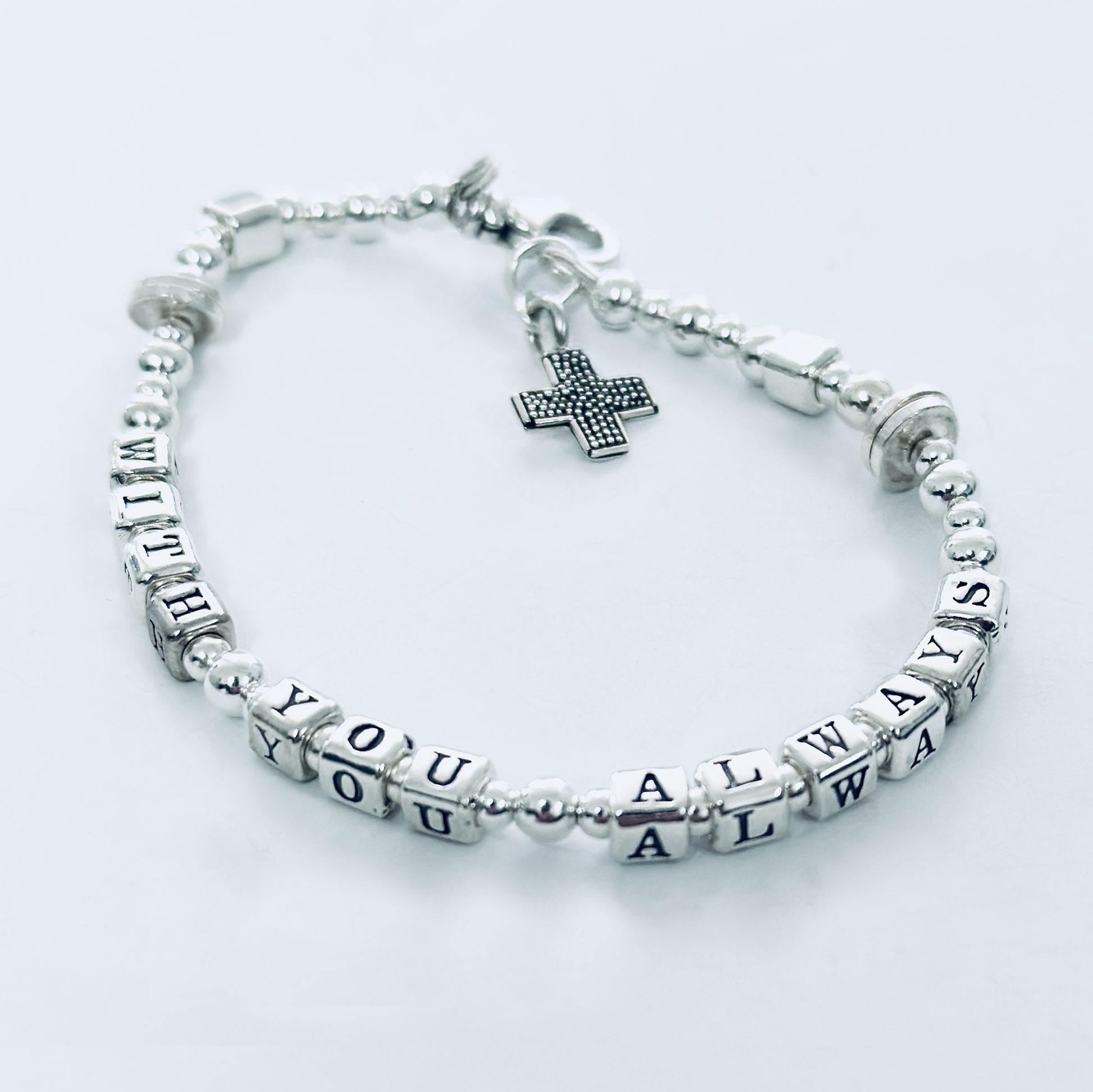 Sterling silver message bracelet with cross charm spells out bible verse Matthew 28:20, "With You Always" 